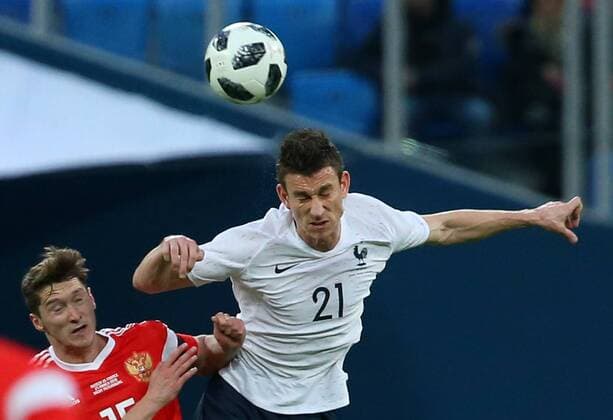 ST PETERSBURG, RUSSIA - MARCH 27, 2018: Russia s Alexei Miranchuk (L) and France s Laurent Koscielny in action in their friendly football match at Saint Petersburg Stadium. Peter Kovalev TASS  TS0799F0
