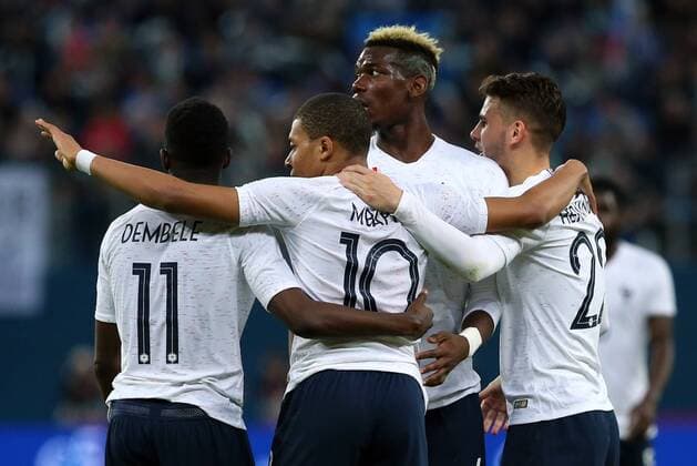 ST PETERSBURG, RUSSIA - MARCH 27, 2018: France s Ousmane Dembele, Kylian Mbappe and Lucas Hernandez (L-R front) celebrate scoring in a friendly football match against Russia at Saint Petersburg Stadium. Peter Kovalev TASS  TS0799F5