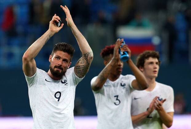 ST PETERSBURG, RUSSIA - MARCH 27, 2018: France s Olivier Giroud and Presnel Kimpembe (L-R) celebrate victory in a friendly football match against Russia at Saint Petersburg Stadium. The French team won the game 3-1. Peter Kovalev TASS  TS079A50
