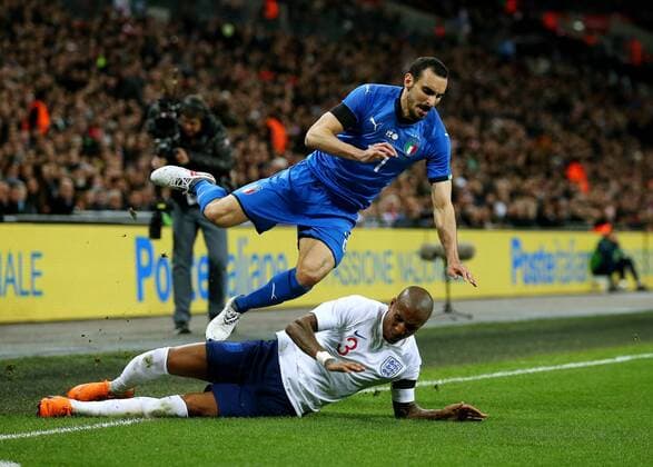 27th March 2018, Wembley Stadium, London, England; International Football Friendly, England versus Italy; Ashley Young of England aggressively fouls Davide Zappacosta of Italy with a slide tackle  ActionPlus12006096
