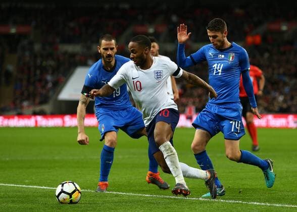 27th March 2018, Wembley Stadium, London, England; International Football Friendly, England versus Italy; Raheem Sterling of England breaks past Frello Filho of Italy and Leonardo Bonucci of Italy  ActionPlus12006100