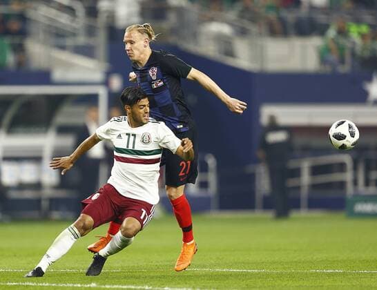 March 27, 2018 - Arlington, Texas, USA - March 27, 2018, Arlington Tx., USA. Carlos Vela (11) of Mexico and Domagoj Vida (21) of Croatia fight for position during the second half of the Mexico vs Croatia International Friendly Länderspiel match at ATT Stadium in Arlington, Texas. Croatia defeated Mexico 1 to 0. Mexico vs Croatia - ZUMAl92_ 20180327_zaf_l92_036 Copyright: xRalphxLauerx