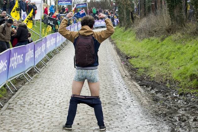 A fans pulls off his pants at the Oude Kwaremont hill in Kluisbergen during the 102nd edition of the Ronde van Vlaanderen - Tour des Flandres - Tour of Flanders one day cycling race, 264,7km from Antwerp to Oudenaarde, Sunday 01 April 2018. KRISTOFxVANxACCOM  x05322420x