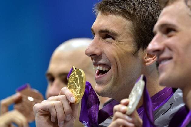 - LONDON, UNITED KINGDOM: US swimmer Michael Phelps (C) poses on the podium with the gold medal flanked by silver medalist US swimmer Ryan Lochte (R) and bronze medalist Hungary s Laszlo Cseh (L) after winning the men s 200m Individual medley final swimming event at the 2012 Summer Olympic Games Olympische Spiele Olympia OS Thursday 02 August 2012 in London, United Kingdom. DIRKxWAEM  x36981150x