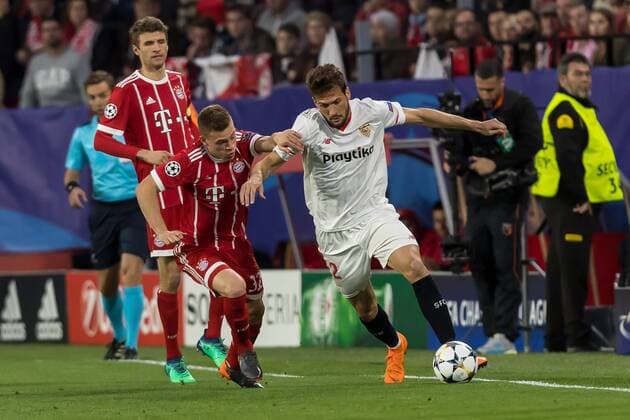 Spain, Sevilla 03.04.2018, UEFA Champions League - 2017 18 Season, Quarter-finals, First leg, Sevilla FC - FC Bayern Muenchen, Joshua Kimmich (FCB) und Franco Vazquez (FCS) im Zweikampf ( DeFodi048