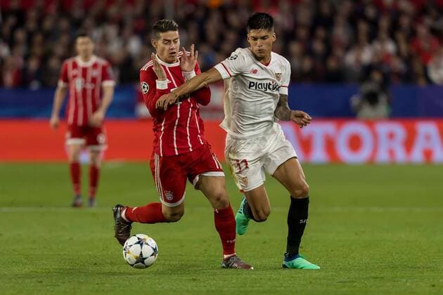 Spain, Sevilla 03.04.2018, UEFA Champions League - 2017 18 Season, Quarter-finals, First leg, Sevilla FC - FC Bayern Muenchen, James Rodriguez (FCB) und Joaquin Correa (FCS) im Zweikampf ( DeFodi048