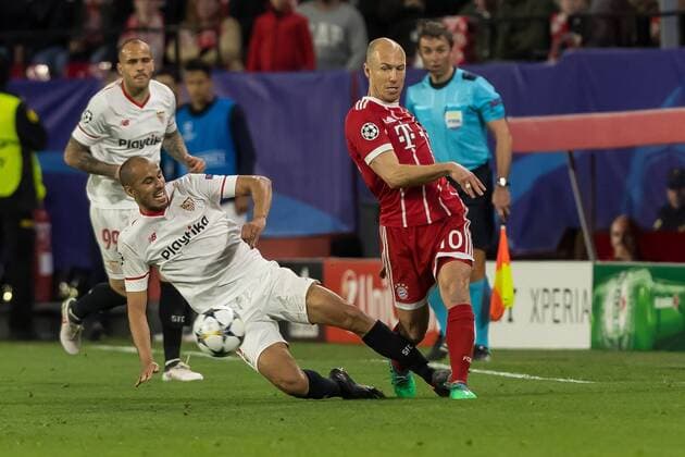 Spain, Sevilla 03.04.2018, UEFA Champions League - 2017 18 Season, Quarter-finals, First leg, Sevilla FC - FC Bayern Muenchen, Guido Pizarro (FCS) und Arjen Robben (FCB) im Zweikampf ( DeFodi048
