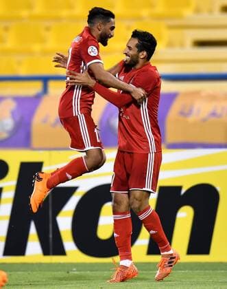 (180404) -- DOHA, April 4, 2018 -- Ali Mabkhout Al Hajeri (R) of Al Jazira FSC celebrates with teammate Salim Rashid (L) after scoring the third goal against Al Gharafa during the AFC Champions League Group A soccer match between Qatar s Al Gharafa and Al Jazira FSC of the United Arab Emirates (UAE) at Thani Bin Jassim Stadium in Doha, capital of Qatar, April 3, 2018. Al Jazira FSC won 3-2. ) (SP)QATAR-DOHA-SOCCER-AFC CHAMPIONS LEAGUE Nikku 