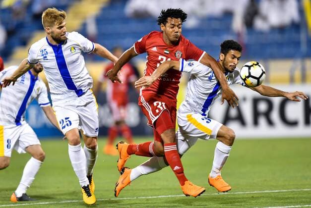(180404) -- DOHA, April 4, 2018 -- Diogo Amado (L) and Tameem Al Muhaza (R) of Al Gharafa vie with Romarinho (C) of Al Jazira FSC during the AFC Champions League Group A soccer match between Qatar s Al Gharafa and Al Jazira FSC of the United Arab Emirates (UAE) at Thani Bin Jassim Stadium in Doha, capital of Qatar, April 3, 2018. Al Jazira FSC won 3-2. ) (SP)QATAR-DOHA-SOCCER-AFC CHAMPIONS LEAGUE Nikku 