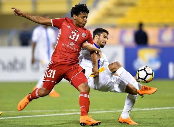 (180404) -- DOHA, April 4, 2018 -- Tameem Al Muhaza (R) of Al Gharafa vies with Romarinho of Al Jazira FSC during the AFC Champions League Group A soccer match between Qatar s Al Gharafa and Al Jazira FSC of the United Arab Emirates (UAE) at Thani Bin Jassim Stadium in Doha, capital of Qatar, April 3, 2018. Al Jazira FSC won 3-2. ) (SP)QATAR-DOHA-SOCCER-AFC CHAMPIONS LEAGUE Nikku 