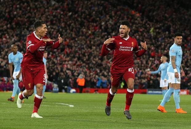 Alex Oxlade-Chamberlain of Liverpool (r) celebrate scoring the second goal during the Champions League Quarter Final 1st Leg, match at Anfield Stadium, Liverpool. Picture date: 4th April 2018. Picture credit should read: Simon Bellis Sportimage EDITORIAL USE ONLY. No use with unauthorised audio, video, data, fixture lists, club league logos or live services. Online in-match use limited to 120 images, no video emulation. No use in betting, games or single club league player publications.