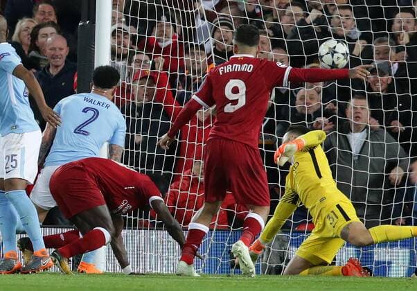4th April 2018, Anfield, Liverpool, England; UEFA Champions League football, quarter final 1st leg, Liverpool versus Manchester City; Sadio Mane of Liverpool beats Ederson of Manchester City to score Liverpool s third goal in the 31st minute  ActionPlus12008369