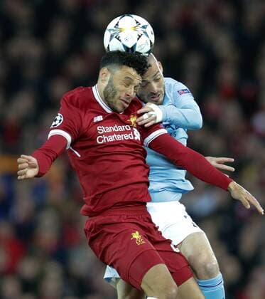 4th April 2018, Anfield, Liverpool, England; UEFA Champions League football, quarter final 1st leg, Liverpool versus Manchester City; Alex Oxlade-Chamberlain of Liverpool challenge David Silva of Manchester City for the header  ActionPlus12008374