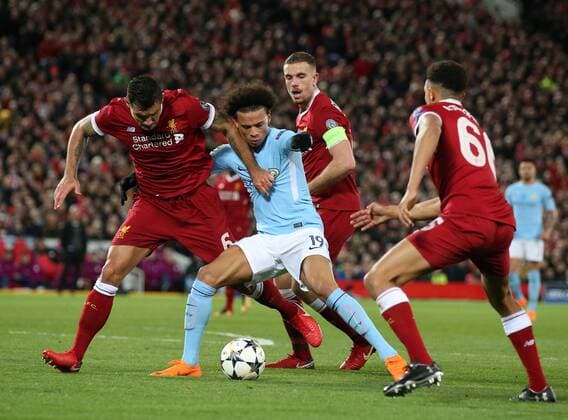 Bilder des Tages - SPORT No way through for Leroy Sane of Manchester City as Dejan Lovren and Jordan Henderson of Liverpool close him down during the Champions League Quarter Final 1st Leg, match at Anfield Stadium, Liverpool. Picture date: 4th April 2018. Picture credit should read: Simon Bellis Sportimage EDITORIAL USE ONLY. No use with unauthorised audio, video, data, fixture lists, club league logos or live services. Online in-match use limited to 120 images, no video emulation. No use in betting, games or single club league player publications.