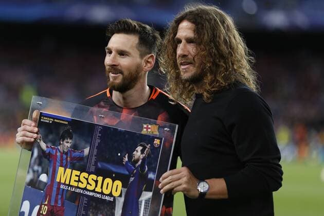 4th April 2018, Camp Nou, Barcelona, Spain; UEFA Champions League football, quarter final 1st leg, Barcelona versus AS Roma; Leo Messi of FC Barcelona Barca receives the trophy from Puyol for scoring 100 goals in the Champions League competition  ActionPlus12008396