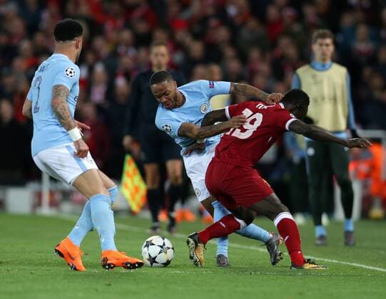 4th April 2018, Anfield, Liverpool, England; UEFA Champions League football, quarter final 1st leg, Liverpool versus Manchester City; Raheem Sterling of Manchester City tangles with Sadio Mane of Liverpool  ActionPlus12008555