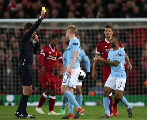 Bilder des Tages - SPORT 4th April 2018, Anfield, Liverpool, England; UEFA Champions League football, quarter final 1st leg, Liverpool versus Manchester City; Raheem Sterling of Manchester City protests as he is shown a yellow card for his foul on Sadio Mane of Liverpool  ActionPlus12008562