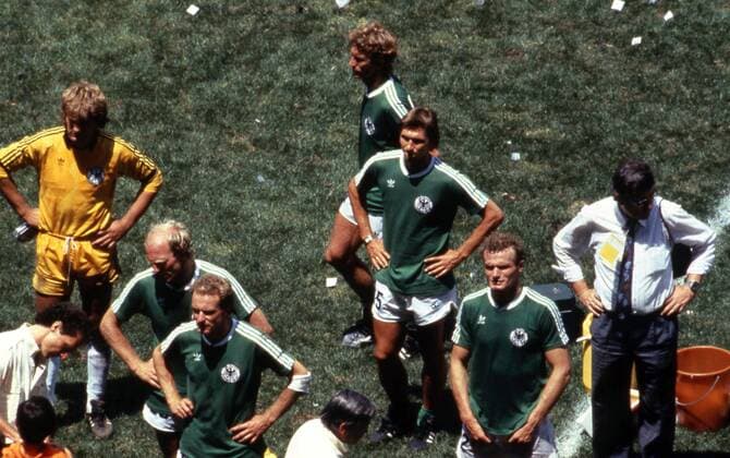 FIFA World Cup WM Weltmeisterschaft Fussball - Mexico 1986 29.6.1986, Estadio Azteca, Mexico, D.F. Final Argentina v West Germany. Disappointed West German players after the defeat. Bottom left coach Franz Beckenbauer is signing an autograph to a ballboy, players from left reserve goalkeeper Ulrich Uli Stein, Dieter He, karl-HEinz Rummenigge, Ditmar Jakobs, Klaus Augenthaler & Hans-Peter Briegel. Noxthirdxpartyxsales  (75100448)