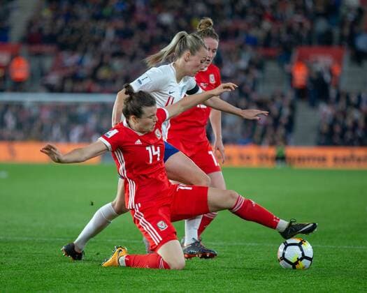 Hayley Ladd(14) of Wales tackles Toni Duggan(11) of England during the 2019 World Cup Qualification match between England Women and Wales Women at the St Mary s Stadium, Southampton, England on 6 April 2018. Copyright: xSimonxCarltonx 19510020