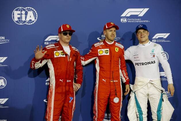 April 7, 2018 - Sakhir, Kingdom of Bahrain - KIMI RAIKKONEN of Scuderia Ferrari, SEBASTIAN VETTEL of Scuderia Ferrari and VALTTERI BOTTAS of Mercedes AMG Petronas Motorsport are seen after the 2018 FIA Formula 1 Bahrain Grand Prix qualifying session at Bahrain International Circuit in Sakhir, Kingdom of Bahrain. Bahrain Grand Prix 2018 - Qualifying - ZUMAg147 20180407_zap_g147_042 Copyright: xJamesxGasperottix