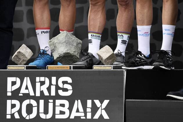 Illustration picture shows the legs of Swiss Silvan Dillier of AG2R La Mondiale, Slovakian Peter Sagan of Bora-Hansgrohe and Dutch Niki Terpstra of Quick-Step Floors on the podium after the 116th edition of the Paris-Roubaix one day cycling race, from Compiegne, near Paris to Roubaix. YORICKxJANSENS  x05326169x
