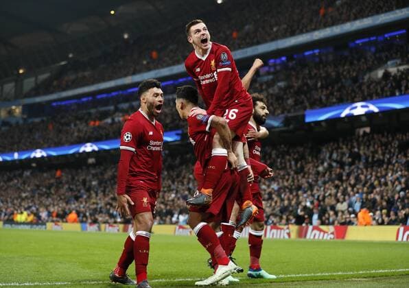 Liverpool s Mohamed Salah celebrates scoring his sides opening goal with Andy Robertson during the Champions League Quarter Final 2nd Leg match at the Etihad Stadium, Manchester. Picture date: 10th April 2018. Picture credit should read: David Klein Sportimage EDITORIAL USE ONLY. No use with unauthorised audio, video, data, fixture lists, club league logos or live services. Online in-match use limited to 120 images, no video emulation. No use in betting, games or single club league player publications.