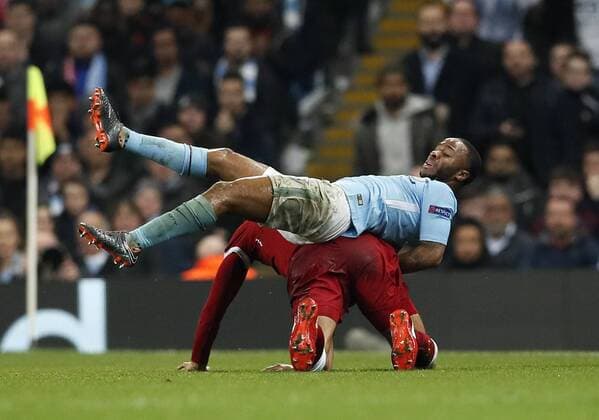 Manchester City s Raheem Sterling ends up in Liverpool s Virgil Van Dijk?s back during the Champions League Quarter Final 2nd Leg match at the Etihad Stadium, Manchester. Picture date: 10th April 2018. Picture credit should read: David Klein Sportimage EDITORIAL USE ONLY. No use with unauthorised audio, video, data, fixture lists, club league logos or live services. Online in-match use limited to 120 images, no video emulation. No use in betting, games or single club league player publications.
