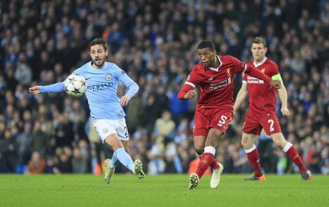 10th April 2018, Etihad Stadium, Manchester, England; UEFA Champions League football, quarter final, second leg; Manchester City verses Liverpool; Georginio Wijnaldum of Liverpool passes the ball under pressure from Bernardo Silva of Manchester City  ActionPlus12011840