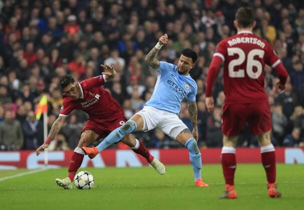 10th April 2018, Etihad Stadium, Manchester, England; UEFA Champions League football, quarter final, second leg; Manchester City verses Liverpool; Roberto Firmino of Liverpool is tackled by Kyle Walker of Manchester City  ActionPlus12011841