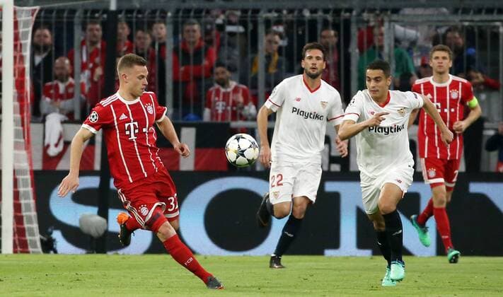 UEFA Champions League, FC Bayern München - Sevilla FC, Viertelfinale Rueckspiel Quarter-Finals 2nd leg, 11.04.2018 in der Allianz Arena, Saison 2017 18, xmdx, Wissam BEN YEDDER (9, Sevilla FC), Joshua KIMMICH (32, FC Bayern Muenchen) FC Bayern Muenchen - Sevilla FC