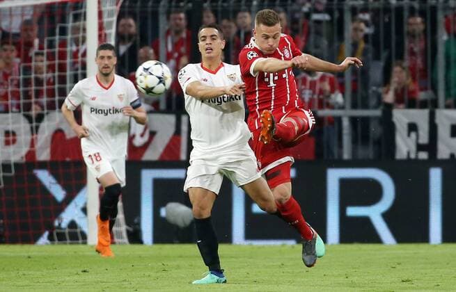 UEFA Champions League, FC Bayern München - Sevilla FC, Viertelfinale Rueckspiel Quarter-Finals 2nd leg, 11.04.2018 in der Allianz Arena, Saison 2017 18, xmdx, Wissam BEN YEDDER (9, Sevilla FC), Joshua KIMMICH (32, FC Bayern Muenchen) FC Bayern Muenchen - Sevilla FC