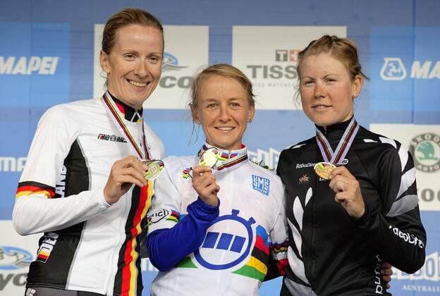 20100928 - GEELONG, AUSTRALIA: Winner Brittish cyclist Emma Pooley (C), 2nd placed German cyclist Judith Arndt (L) and 3rd placed Melanie Villumsen of New Zealand (R), pictured on the podium after the Time trial Women, Wednesday 29 September 2010, in Geelong, Melbourne, Australia, ahead of the 2010 UCI World Road cycling Rad Radsport Strasse championship starting Wednesday 29 September untill 03 October. The cyclists were riding two-by-two which is forbidden. ERICxLALMAND  x22595112x