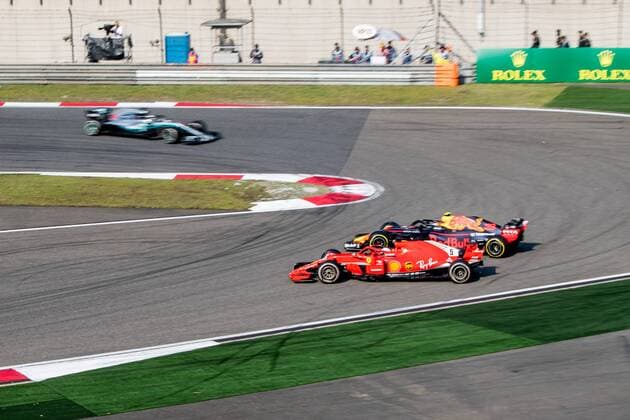 German F1 Sebastian Vettel of Ferrari and Dutch F1 driver Max Verstappen of Red Bull Racing collide as they compete during the 2018 Formula One Chinese Grand Prix at the Shanghai International Circuit in Shanghai, China, 15 April 2018. Daniel Ricciardo charged from sixth to score a stunning first win of the 2018 Formula 1 season as Max Verstappen and Sebastian Vettel collided in a wild Chinese Grand Prix. Bottas and Vettel were locked in their own battle for the win until Ricciardo and Verstappen pitted again for fresh, soft tyres during a safety car period just after the halfway mark as their rivals stayed on mediums. Ricciardo then overtook his team-mate, Lewis Hamilton and Vettel in quick succession before executing a stunning pass on Bottas into the tight Turn 6 right-hander for the victory. Verstappen and Vettel collide in Chinese Grand Prix 