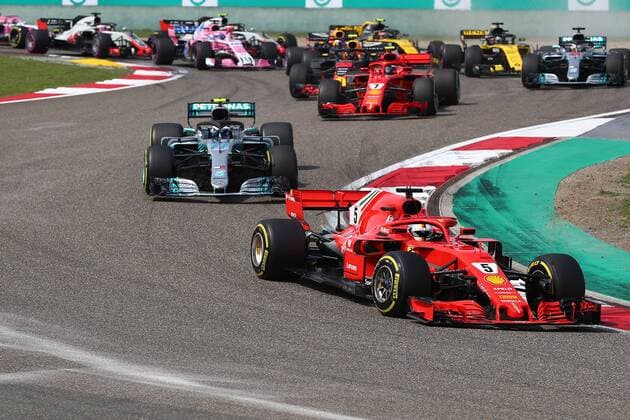 German F1 Sebastian Vettel of Ferrari takes the lead during the 2018 Formula One Chinese Grand Prix at the Shanghai International Circuit in Shanghai, China, 15 April 2018. Daniel Ricciardo charged from sixth to score a stunning first win of the 2018 Formula 1 season as Max Verstappen and Sebastian Vettel collided in a wild Chinese Grand Prix. Bottas and Vettel were locked in their own battle for the win until Ricciardo and Verstappen pitted again for fresh, soft tyres during a safety car period just after the halfway mark as their rivals stayed on mediums. Ricciardo then overtook his team-mate, Lewis Hamilton and Vettel in quick succession before executing a stunning pass on Bottas into the tight Turn 6 right-hander for the victory. Daniel Ricciardo storms to Chinese Grand Prix victory for Red Bull 