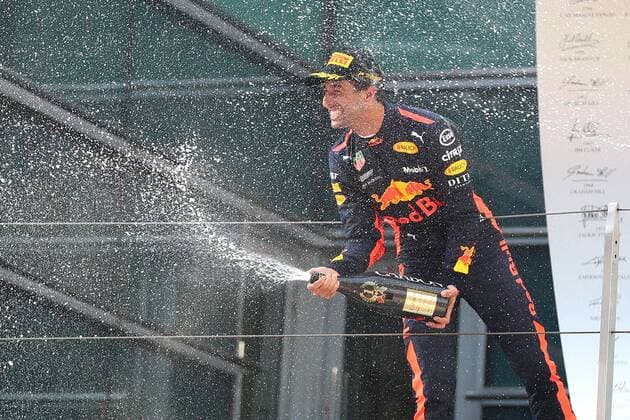 Australian F1 driver Daniel Ricciardo of Red Bull Racing sprays champagne to celebrate on the podium after winning the 2018 Formula One Chinese Grand Prix at the Shanghai International Circuit in Shanghai, China, 15 April 2018. Daniel Ricciardo charged from sixth to score a stunning first win of the 2018 Formula 1 season as Max Verstappen and Sebastian Vettel collided in a wild Chinese Grand Prix. Bottas and Vettel were locked in their own battle for the win until Ricciardo and Verstappen pitted again for fresh, soft tyres during a safety car period just after the halfway mark as their rivals stayed on mediums. Ricciardo then overtook his team-mate, Lewis Hamilton and Vettel in quick succession before executing a stunning pass on Bottas into the tight Turn 6 right-hander for the victory. Daniel Ricciardo storms to Chinese Grand Prix victory for Red Bull 