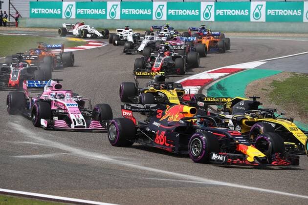 Australian F1 driver Daniel Ricciardo of Red Bull Racing takes the lead during the 2018 Formula One Chinese Grand Prix at the Shanghai International Circuit in Shanghai, China, 15 April 2018. Daniel Ricciardo charged from sixth to score a stunning first win of the 2018 Formula 1 season as Max Verstappen and Sebastian Vettel collided in a wild Chinese Grand Prix. Bottas and Vettel were locked in their own battle for the win until Ricciardo and Verstappen pitted again for fresh, soft tyres during a safety car period just after the halfway mark as their rivals stayed on mediums. Ricciardo then overtook his team-mate, Lewis Hamilton and Vettel in quick succession before executing a stunning pass on Bottas into the tight Turn 6 right-hander for the victory. Daniel Ricciardo storms to Chinese Grand Prix victory for Red Bull 
