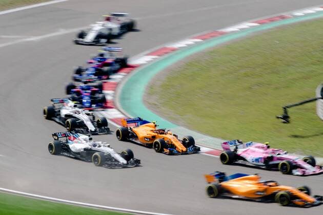 F1 drivers compete during the 2018 Formula One Chinese Grand Prix at the Shanghai International Circuit in Shanghai, China, 15 April 2018. Daniel Ricciardo charged from sixth to score a stunning first win of the 2018 Formula 1 season as Max Verstappen and Sebastian Vettel collided in a wild Chinese Grand Prix. Bottas and Vettel were locked in their own battle for the win until Ricciardo and Verstappen pitted again for fresh, soft tyres during a safety car period just after the halfway mark as their rivals stayed on mediums. Ricciardo then overtook his team-mate, Lewis Hamilton and Vettel in quick succession before executing a stunning pass on Bottas into the tight Turn 6 right-hander for the victory. Daniel Ricciardo storms to Chinese Grand Prix victory for Red Bull 