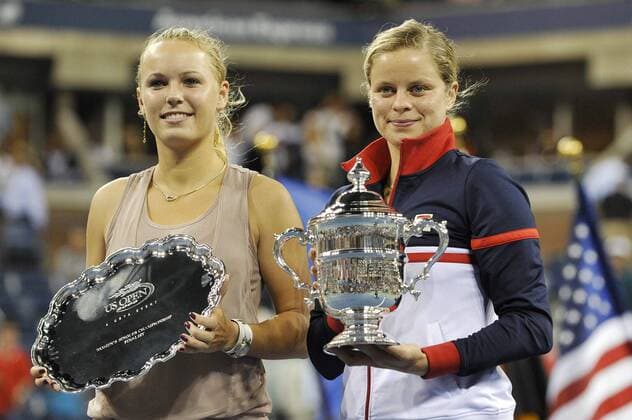 - NEW YORK, USA : Belgian tennis player Kim Clijsters, holds the trophy near runner up Caroline Wozniaki of Denmark during the ceremony after Kim Clijsters won 7-5, 6-3 the US Open final match at Grand Slam Tennis tournament, at Flushing Meadows, in New York, Sunday 13 September 2009. Clijsters won a Grand Slam title just one month after her coming back to competition, after two years break during wich she became a mother. PHILIPPExBUISSIN  x15359128x