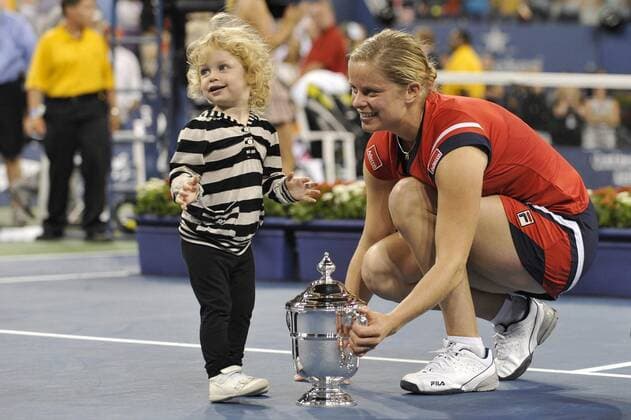 - NEW YORK, USA : Belgian tennis player Kim Clijsters and her daughter Jada Ellie Lynch pictured with the trophy during the ceremony after she won 7-5, 6-3 the US Open final match against Caroline Wozniaki of Denmark, at the US Open Grand Slam Tennis tournament, at Flushing Meadows, in New York, Sunday 13 September 2009. Clijsters won a Grand Slam title just one month after her coming back to competition, after two years break during wich she became a mother. PHILIPPExBUISSIN  x15359562x