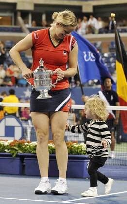 - NEW YORK, USA : L-R, Belgian tennis player Kim Clijsters and her daughter Jada Ellie Lynch pictured with the trophy during the ceremony after she won 7-5, 6-3 the US Open final match against Caroline Wozniaki of Denmark, at the US Open Grand Slam Tennis tournament, at Flushing Meadows, in New York, Sunday 13 September 2009. Clijsters won a Grand Slam title just one month after her coming back to competition, after two years break during wich she became a mother. PHILIPPExBUISSIN  x15359714x