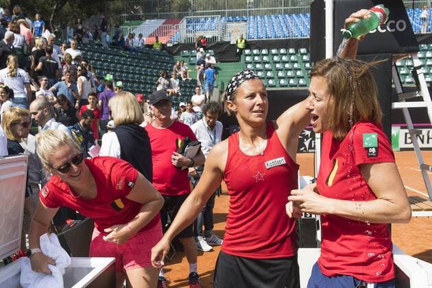 Belgian Ysaline Bonaventure, Belgian Kirsten Flipkens and Belgium Assistant coach Laurence Courtois celebrate after winning a double tennis game between Italian pair Deborah Chiesa and Jessica Pieri and Belgian pair Kirsten Flipkens and Elise Mertens, the fourth rubber of this weekend s Fed Cup World Group Play Off meeting between Italy and Belgium in Genoa, Italy, Sunday 22 April 2018. Belgian already won 0-3. LAURIExDIEFFEMBACQ  x05334217x