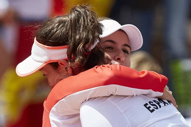 April 22, 2018 - La Manga, Murcia, Spain - Garbine Muguruza (L) of Spain celebrates the victory in her match against Veronica Cepede Royg of Paraguay during day two of the Fedcup World Group II Play-offs match between Spain and Paraguay at Centro de Tenis La Manga Club on April 22, 2018 in La Manga, Spain Spain v Paraguay - Fed Cup by BNP Paribas World Cup Group II Play-Off  - ZUMAn230 20180422_zaa_n230_619 Copyright: xDavidxAliagax