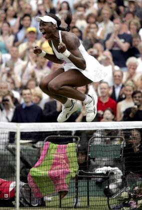 BRU104 - - WIMBLEDON, UNITED KINGDOM : US Venus Williams jumps delighted after defeating Lindsay Davenport in their final match of the Wimbledon Tennis Open, Saturday 02 July 2005, at the All England Lawn Tennis Club. DIDIER MOSSIAT DIDIERxMOSSIOAT  x3128034x