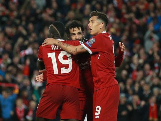 Goalscorer Sadio Mane of Liverpool (l) celebrates with Mohamed Salah of Liverpool (c) and Roberto Firmino of Liverpool (r) during the Champions League Semi Final 1st Leg match at Anfield Stadium, Liverpool. Picture date: 24th April 2018. Picture credit should read: Simon Bellis Sportimage EDITORIAL USE ONLY. No use with unauthorised audio, video, data, fixture lists, club league logos or live services. Online in-match use limited to 120 images, no video emulation. No use in betting, games or single club league player publications.