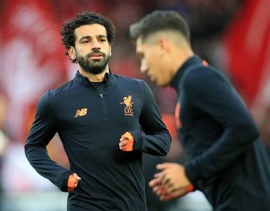 24th April 2018, Anfield, Liverpool, England; UEFA Champions League football, semi final, 1st leg, Liverpool versus AS Roma; Mohamed Salah of Liverpool warms up in front of the Kop before the match  ActionPlus12016871