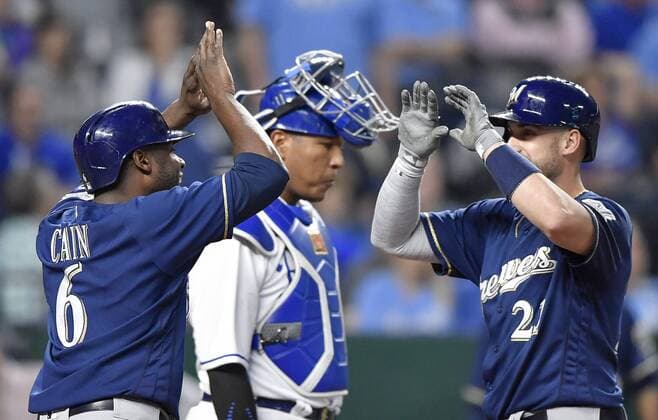 April 24, 2018 - Kansas City, MO, USA - The Milwaukee Brewers Lorenzo Cain (6) congratulates Travis Shaw on his three-run home run in front of Kansas City Royals catcher Salvador Perez in the third inning on Wednesday, April 24, 2018, at Kauffman Stadium in Kansas City, Mo. Milwaukee at Kansas City - ZUMAm67_ 20180424_zaf_m67_025 Copyright: xJohnxSleezerx