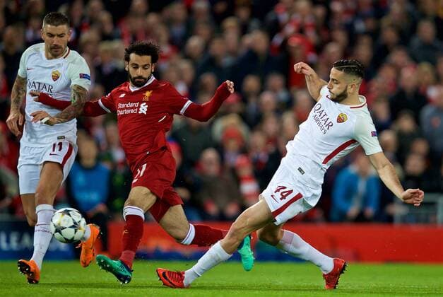 (180425) -- LIVERPOOL, April 25, 2018() -- Liverpool s Mohamed Salah (C) vies with AS Roma s Aleksandar Kolarov (L) and Kostas Manolas during the UEFA Champions League Semifinals 1st leg match between Liverpol FC and AS Roma at the Anfield Stadium in Liverpool, Britain on April 24, 2018. Liverpool won 5-2. ()(wll) (SP)BRITAIN-LIVERPOOL-SOCCER-UEFA-CHAMPIONS LEAGUE-LIVERPOOL VS ROMA Xinhua 