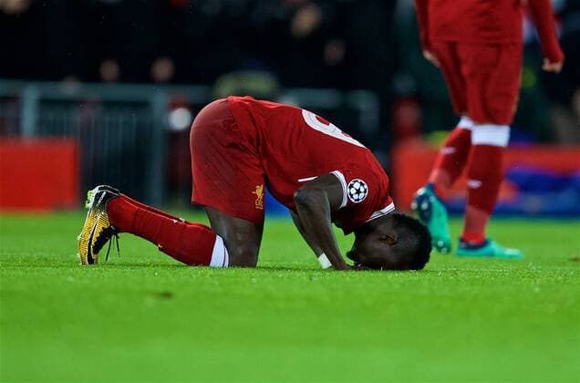 (180425) -- LIVERPOOL, April 25, 2018() -- Liverpool s Sadio Mane kneels to pray as he celebrates scoring the third goal during the UEFA Champions League Semifinals 1st leg match between Liverpol FC and AS Roma at the Anfield Stadium in Liverpool, Britain on April 24, 2018. Liverpool won 5-2. ()(wll) (SP)BRITAIN-LIVERPOOL-SOCCER-UEFA-CHAMPIONS LEAGUE-LIVERPOOL VS ROMA Xinhua 
