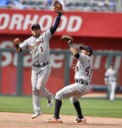 May 3, 2018 - Kansas City, MO, USA - Detroit Tigers shortstop Jose Iglesias catches an infield chopper over shortstop Dixon Machado before throwing Kansas City Royals Whit Merrifield out at first to end the seventh inning during Thursday s baseball game on May 3, 2018, at Kauffman Stadium in Kansas City, Mo. MLB Baseball Herren USA 2018: Royals 10:6 Tigers - ZUMAm67_ 20180503_zaf_m67_071 Copyright: xJohnxSleezerx