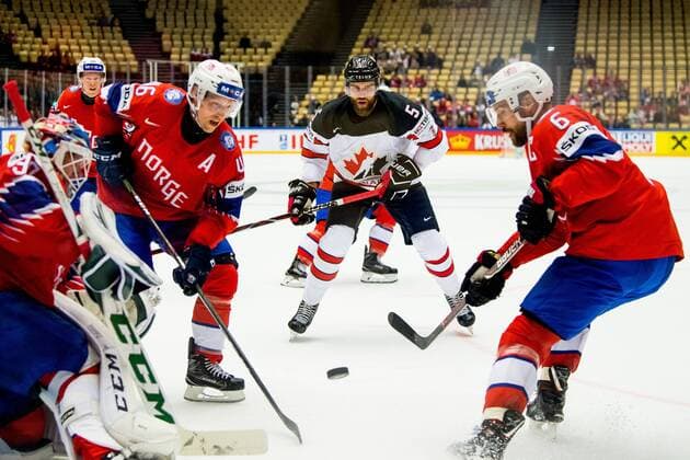 180510 Mathis Olimb of Norway, Aaron Ekblad of Canada and Jonas Hol¿s of Norway during the IIHF Ice hockey Eishockey World Championship WM Weltmeisterschaft match between Norway and Canada on May 10, 2018 in Herning. Photo: Vegard Wivestad Gr¿tt BILDBYRN kod VG 170163 Copyright: VEGARDxWIVESTADxGR¯TT BB180510BB587